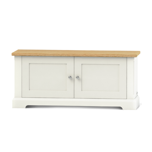 This shoe storage bench is a low lying cupboard with Shaker style doors. The top surface is made of oak making it a durable to sit on while your change into your footwear.