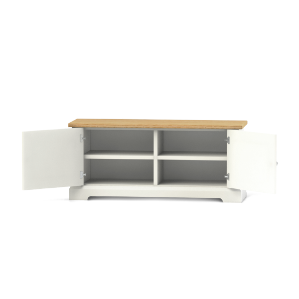 This shoe storage bench is a low lying cupboard with Shaker style doors. The top surface is made of oak making it a durable to sit on while your change into your footwear.