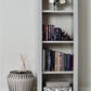 Slimline tall bookcase with a flat top and height adjustable shelves.