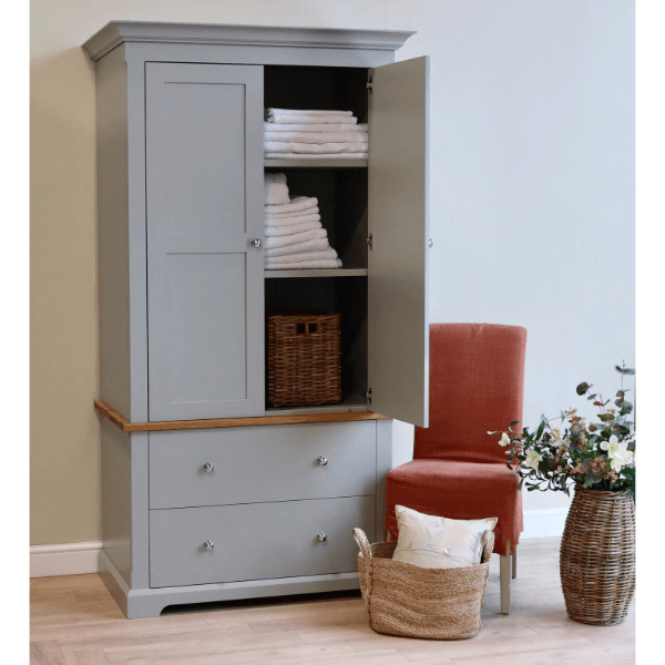 Housekeepers cupboard ideal for storing linen, has two deep soft close drawers and a top cupboard section with internal height adjustable shelves
