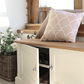 This shoe storage bench is a low lying cupboard with Shaker style doors. The top surface is made of oak making it a durable to sit on while your change into your footwear.