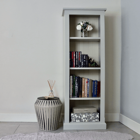 Slimline tall bookcase with a flat top and height adjustable shelves.