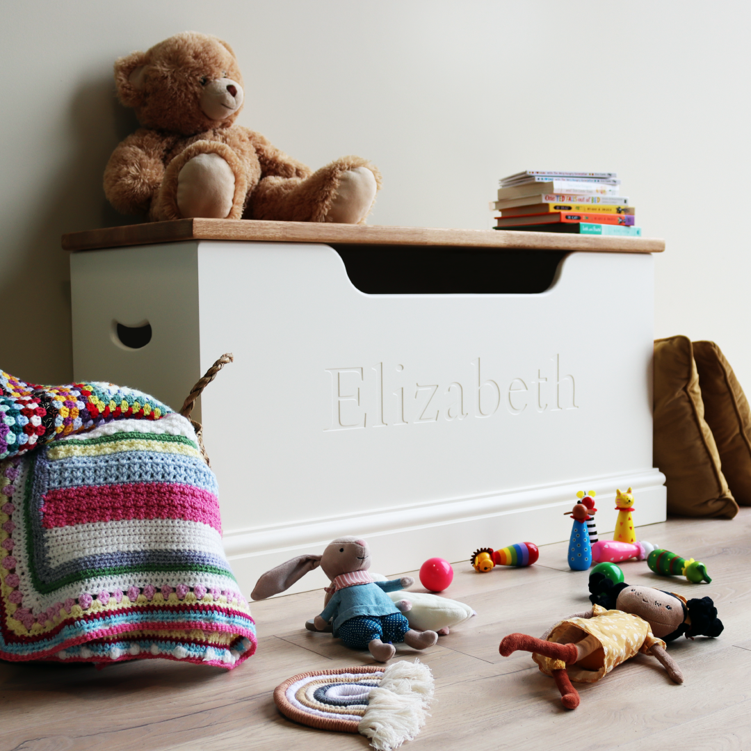 personalised toy box with oak lid in a childrens bedroom, playroom or nursery.